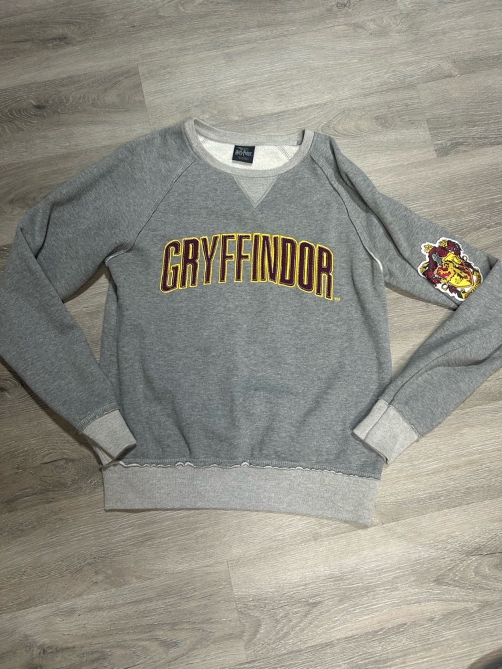 Universal Gray Gryffindor Logo Crewneck Sweater with Maroon & Gold Accents